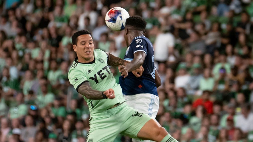 Austin FC midfielder Sebastian Driussi, left, goes up for a head ball against Vancouver Whitecaps defender Javain Brown during the second half of an MLS soccer match Saturday, April 15, 2023, in Austin, Texas. The game ended 0-0. (AP Photo/Michael Thomas)