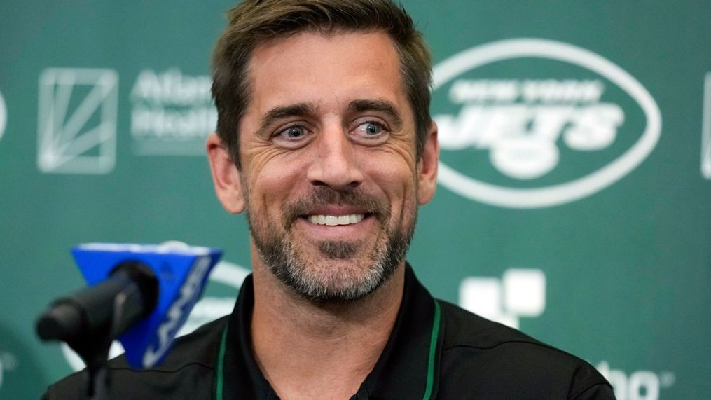 FILE - New York Jets' quarterback Aaron Rodgers smiles during an NFL football news conference at the Jets' training facility in Florham Park, N.J., Wednesday, April 26, 2023. Months after Coloradoâs voters decided to join Oregon in decriminalizing psychedelic mushrooms, Denver will host a conference this week put on by a psychedelic advocacy group bringing together an unlikely cohort of speakers â including Rodgers, former Texas Gov. Rick Perry, and rapper Jaden Smith, the son of actor Will Smith. (AP Photo/Seth Wenig, File)
