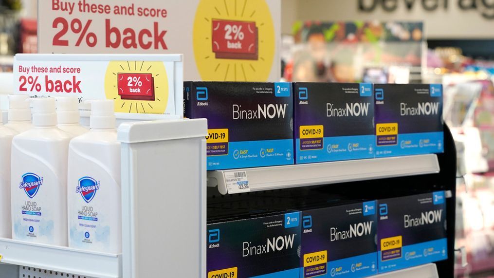 FILE - Boxes of BinaxNow home COVID-19 tests made by Abbott displayed for sale next to liquid hand soap at a CVS store in Lakewood, Wash., Monday, Nov. 15, 2021. (AP Photo/Ted S. Warren, File)