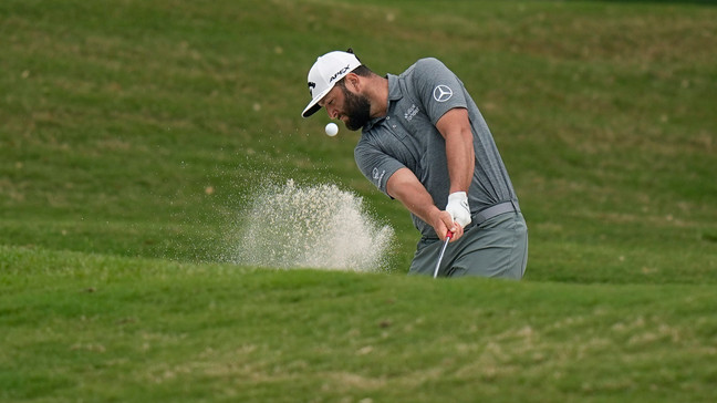 Jon Rahm, of Spain, hits from a fairway bunker on the first hole during the second round of the Dell Technologies Match Play Championship golf tournament in Austin, Texas, Thursday, March 23, 2023. (AP Photo/Eric Gay)