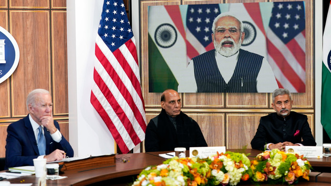President Joe Biden meets virtually with Indian Prime Minister Narendra Modi in the South Court Auditorium on the White House campus in Washington, Monday, April 11, 2022. Indian Minister of Defense Rajnath Singh is center, Minister of External Affairs Subrahmanyam Jaishankar is right. (AP Photo/Carolyn Kaster)