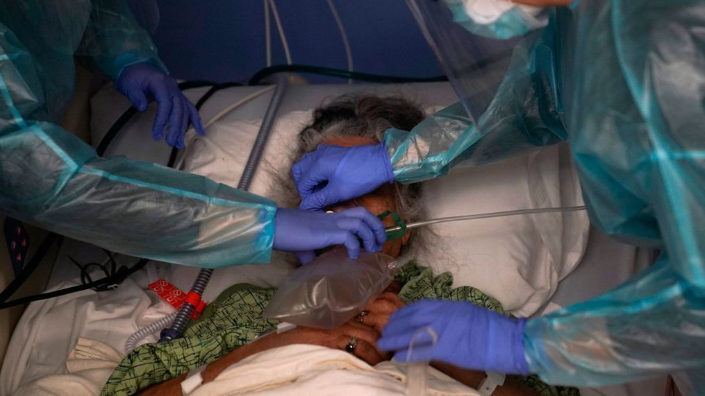 FILE - Two nurses put a ventilator on a patient in a COVID-19 unit at St. Joseph Hospital in Orange, Calif. Thursday, Jan. 7, 2021. California's COVID-19 emergency declaration ends on Tuesday, Feb. 28, 2023. Gov. Gavin Newsom first issued the emergency declaration on March 4, 2020. The emergency ends just as California officially passed 100,000 COVID-related deaths during the pandemic. (AP Photo/Jae C. Hong, File)
