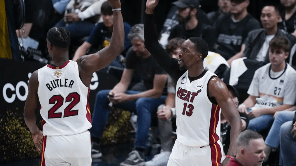 Miami Heat center Bam Adebayo, right, celebrates with forward Jimmy Butler after scoring against the Denver Nuggets during the second half of Game 2 of basketball's NBA Finals, Sunday, June 4, 2023, in Denver. (AP Photo/David Zalubowski)